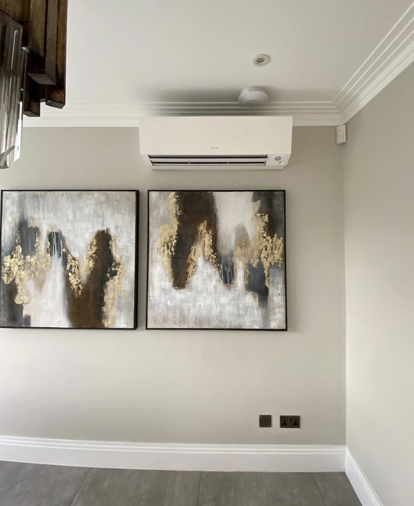 Modern home office with wall-mounted air conditioning unit installed by Evergreen Air Conditioning